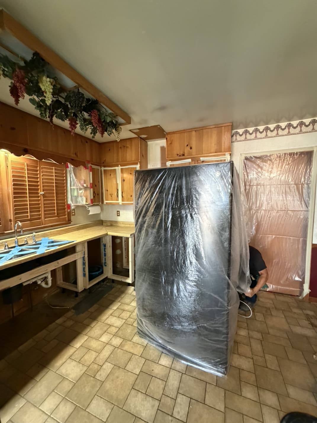 Appliances and openings wrapped in protective sheeting