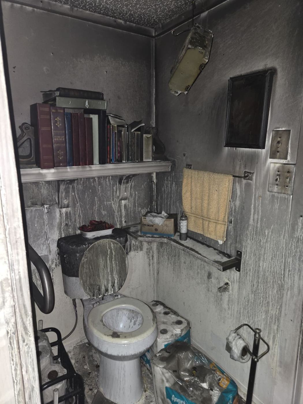 Smoke and fire affected bathroom documented for cleaning and deodorization