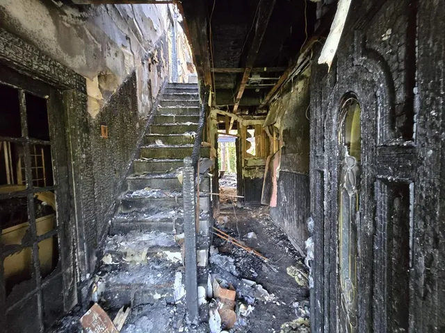 Fire-damaged stairwell and hallway documented during loss assessment