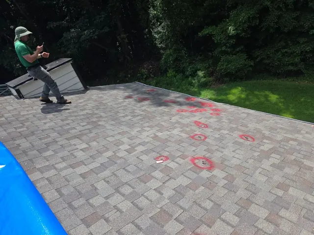 Roof damage locations marked during inspection and documentation