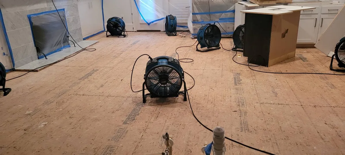 Drying equipment placed through kitchen with finishes masked